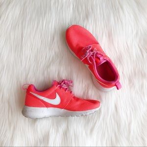 Bright orange Nike Roshe run shoes